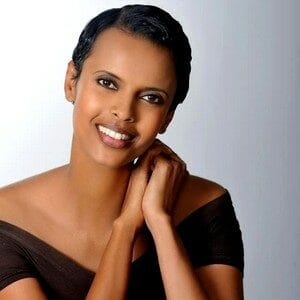 About Us 9 African woman smiling, showcasing natural beauty and confidence.