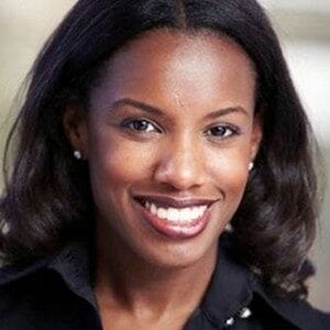 About Us 13 Sheila Marmon smiling portrait, African American woman with natural hair and bright smile.
