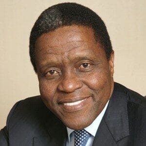 About Us 11 Vusi Khanyile smiling, wearing a suit, professional portrait.