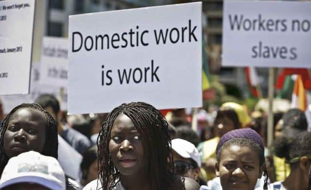 Women protesting for workers' rights at the Africa.com event.