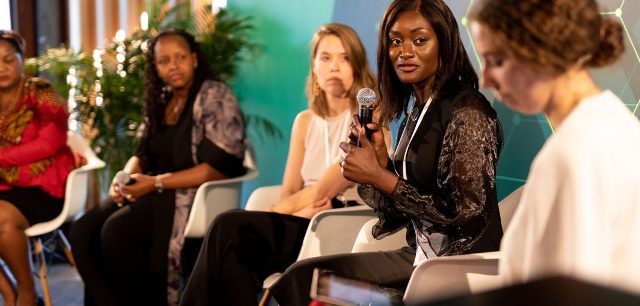 African women discussing banking challenges at a panel discussion.