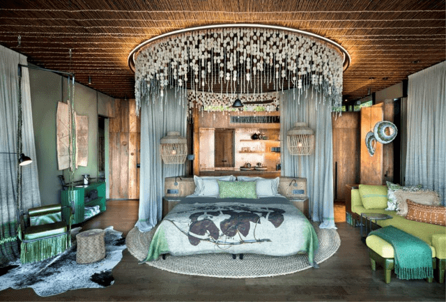 Luxury African-inspired bedroom with vibrant decor and natural materials.