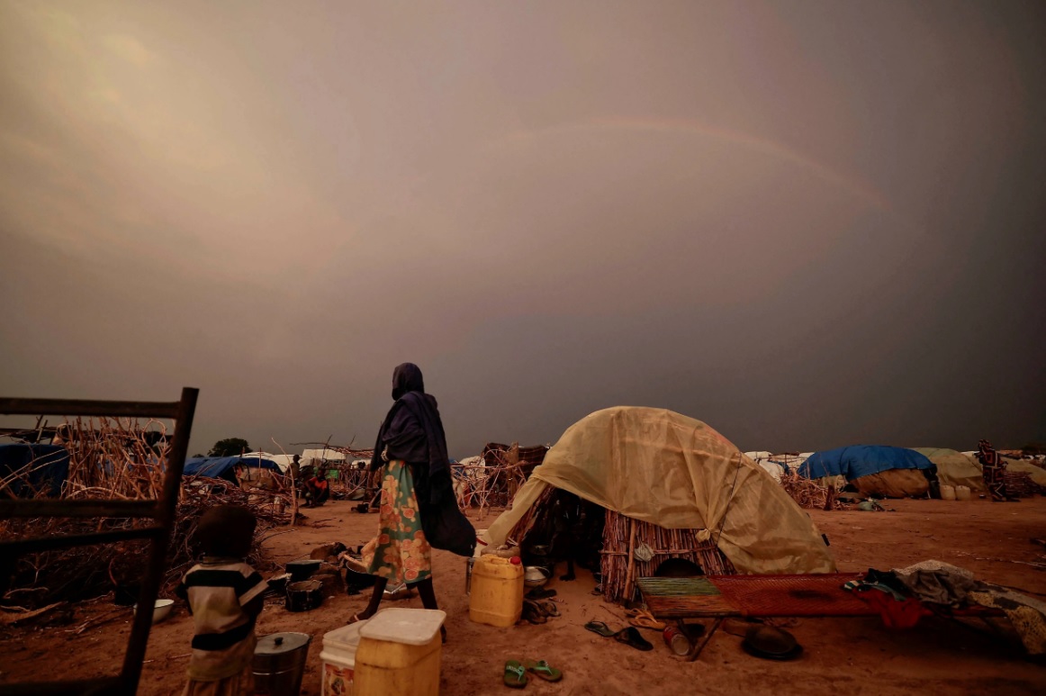 Rainbow over shelters