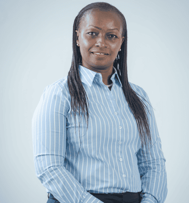 Confident African woman in business attire representing rising wealth in Africa.