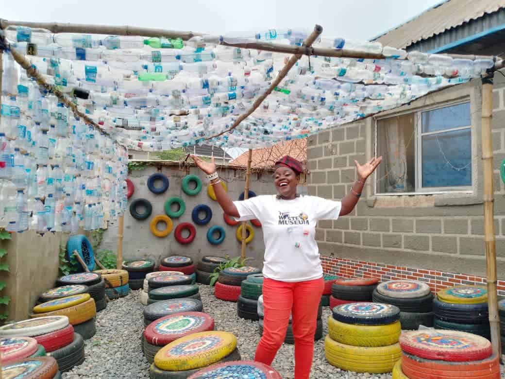 Recycled materials art display at Nigerian museum attracting visitors.