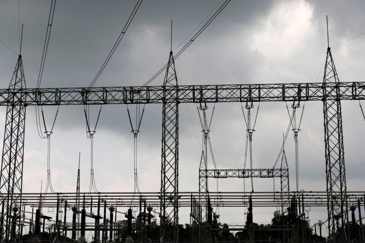Power transmission infrastructure with high-voltage lines and towers in Mozambique.