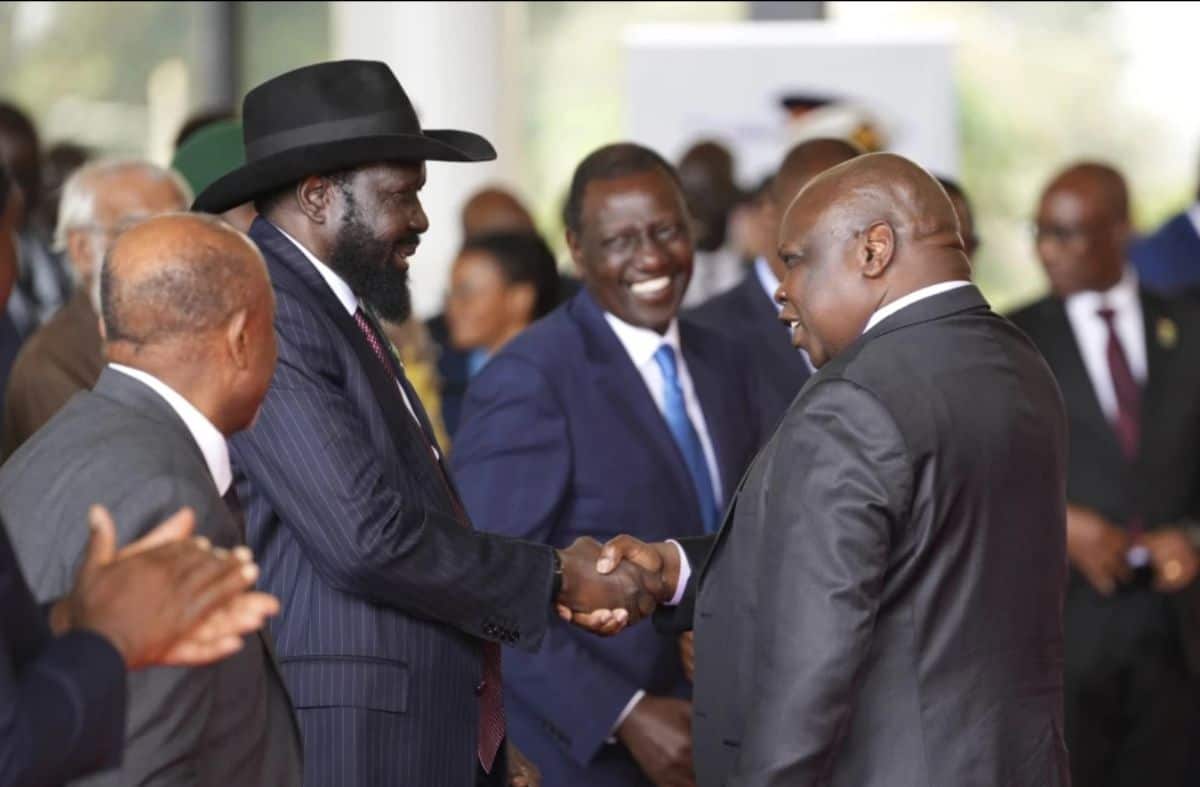 African leaders shaking hands at a mining industry event.