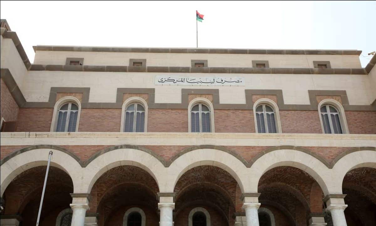 Facade of a historic African government building with Arabic script and flag.