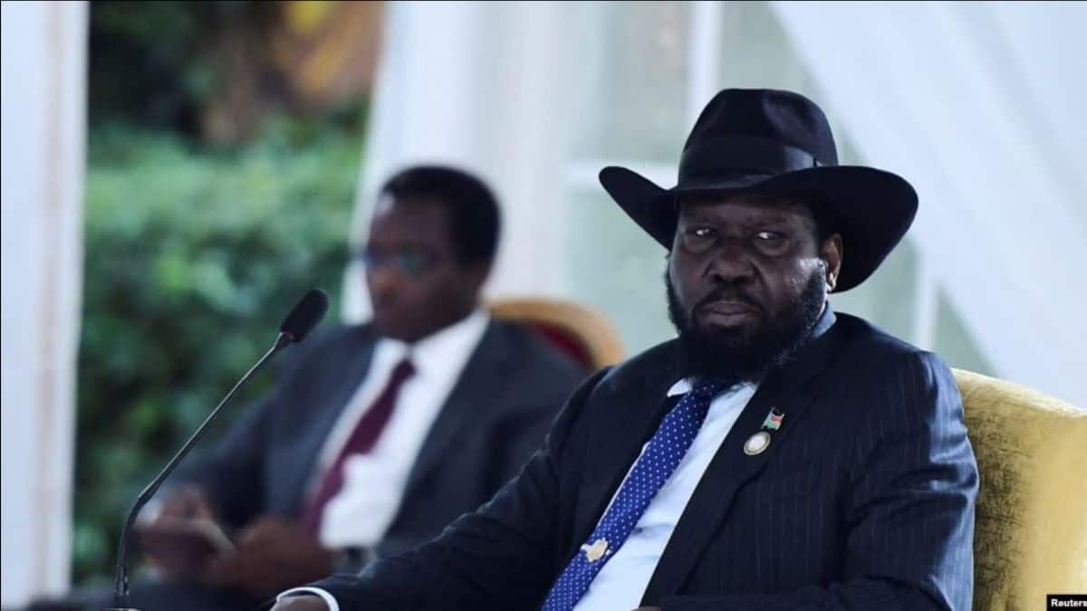 An African leader at a conference addressing climate change threats to Serengeti and Maasai Mara eco.