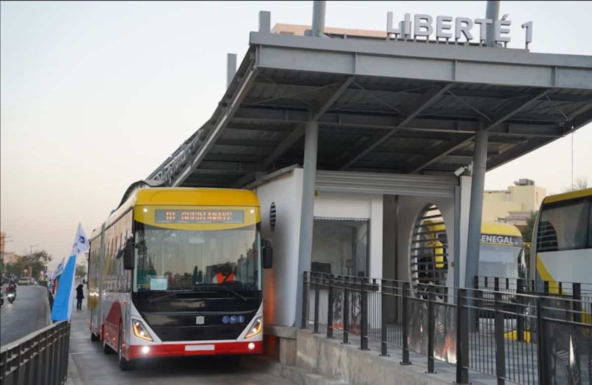 Public transportation station in Africa with buses and modern facilities.
