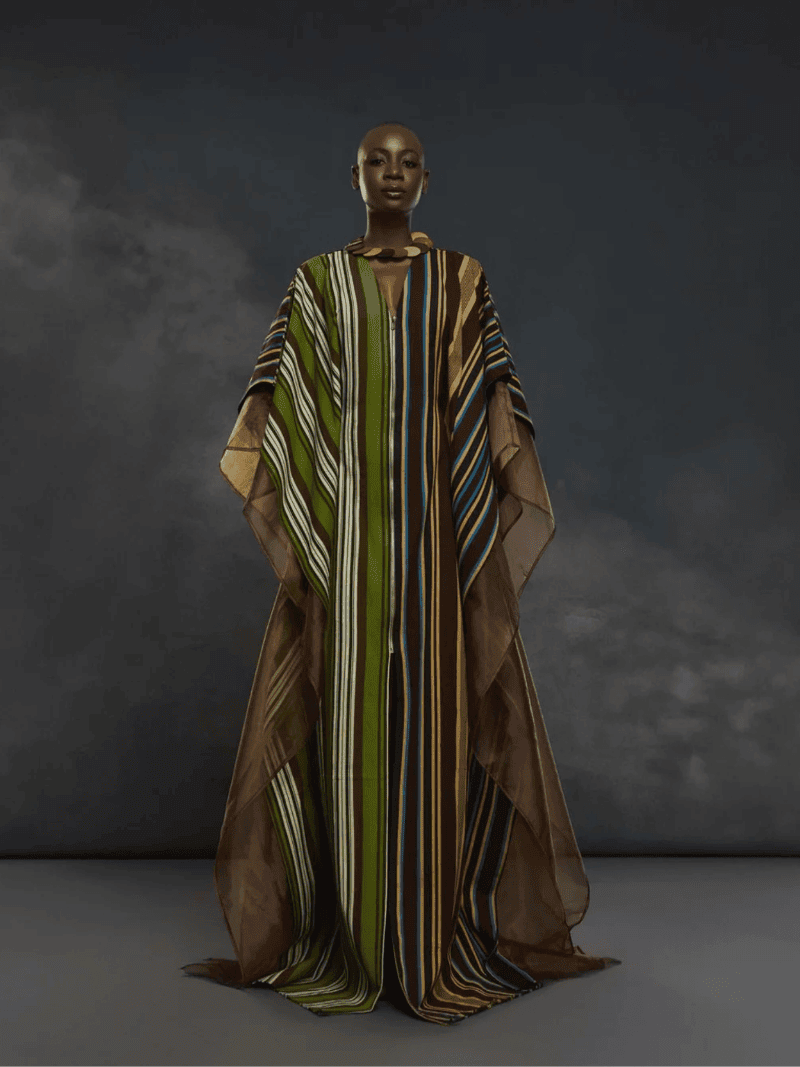 Elegant African-inspired striped dress showcasing cultural fashion for safari adventures.