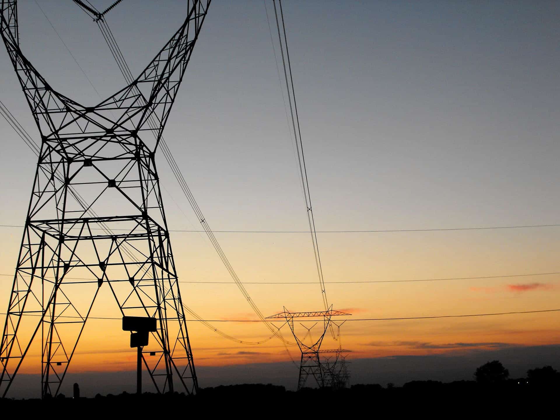 High-voltage power lines and transmission towers supporting electrical grid infrastructure.