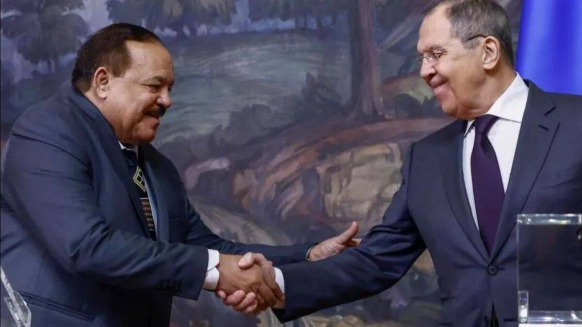 DRC and Rwanda officials shake hands during diplomatic meeting.