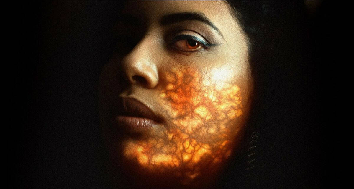 Close-up of a woman's face with fiery, cracked skin effect symbolizing visa and nationality issues.