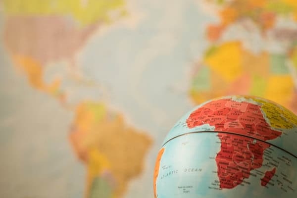 Globe highlighting Africa with emphasis on Sudan, reflecting on conflict and hope.
