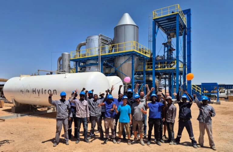 Namibia's green industrial site with workers and renewable energy infrastructure.