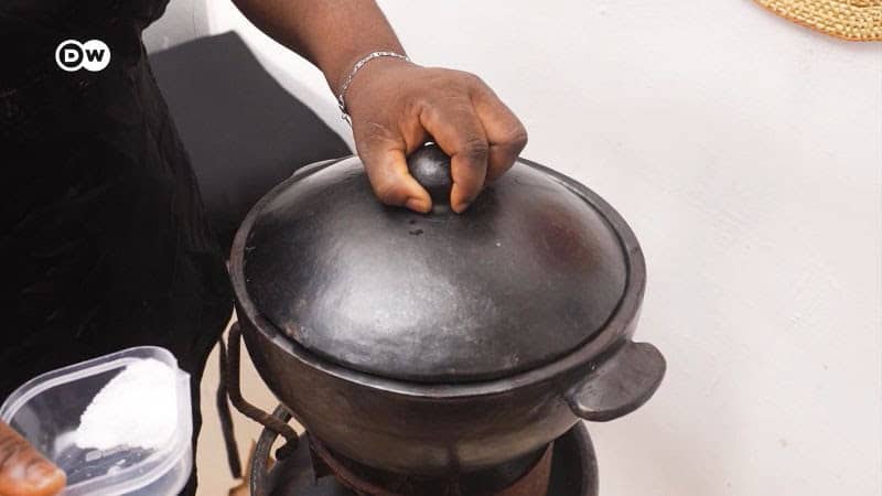 Traditional Zimbabwean cooking pot with lid, highlighting local culinary heritage.