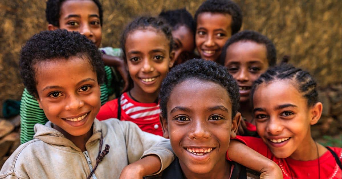 Ethiopian children smiling in inclusive education setting in Ethiopia.
