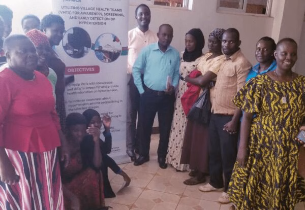 Group photo with the 12 VHTs and others in attendance of the training.