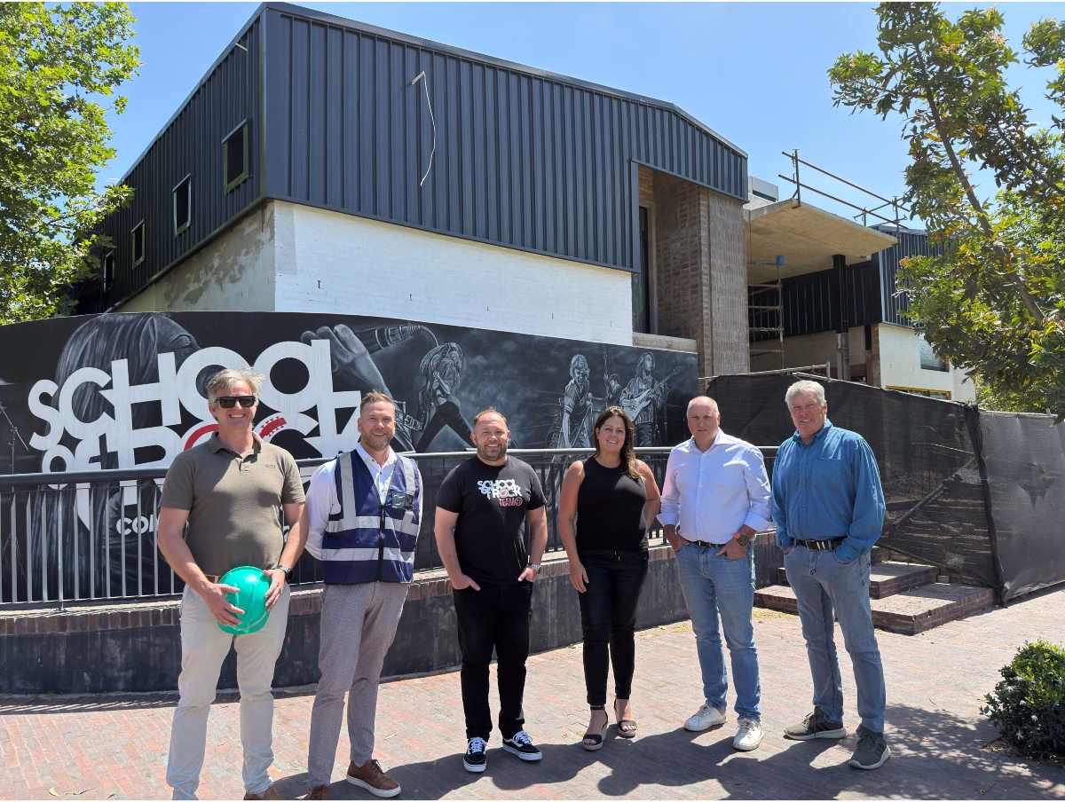 Low res From left Ryan Hunt, Las Lemmer, Keith Taeuber, Leigh Spaun, Carlo Capri, and Deon de Wet outside the soon to be School of Rock Devonbosch marking a new era of music and creati (1)