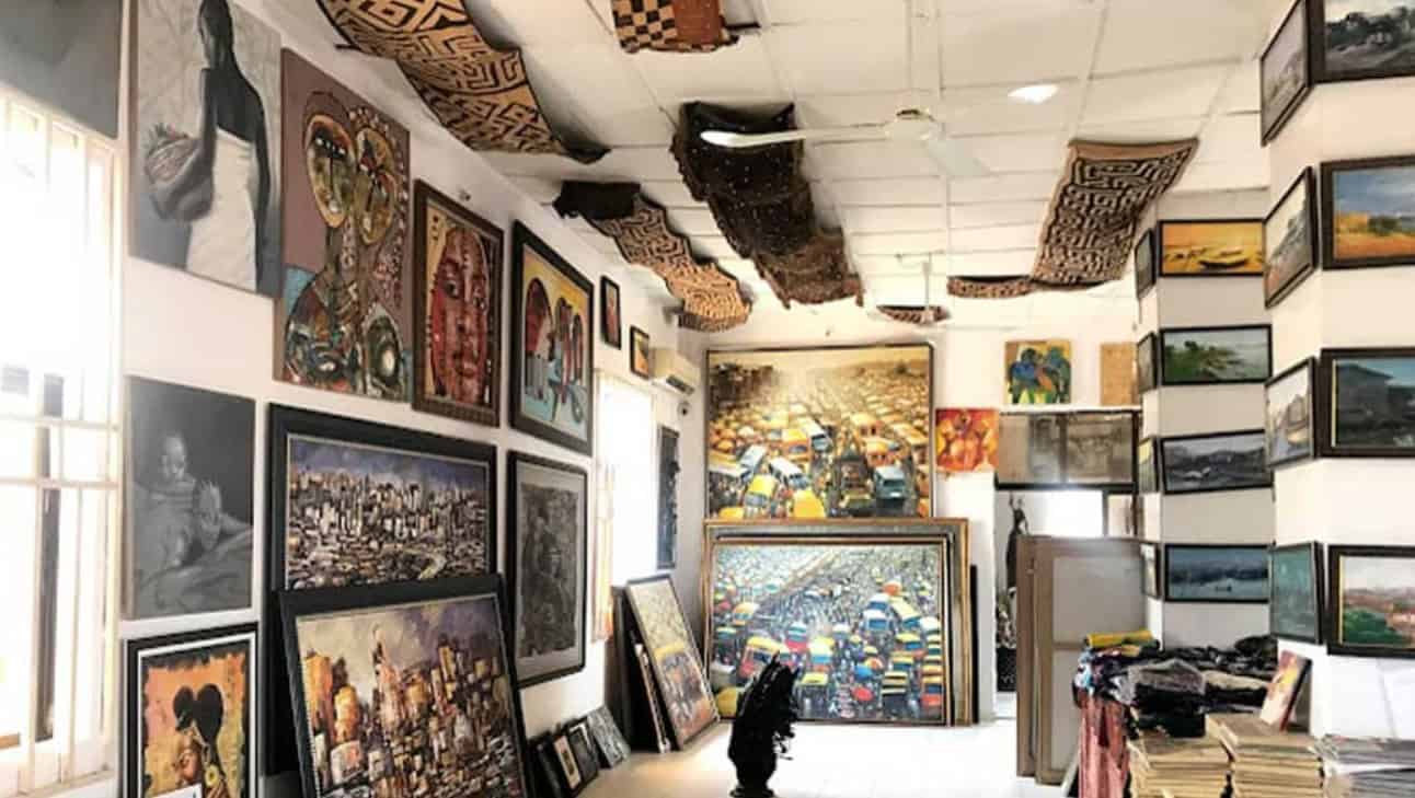 African art gallery showcasing diverse paintings and cultural artwork.