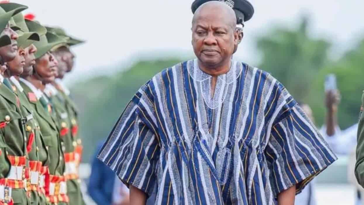 Ghanaian leader in traditional attire at a cultural fashion event in Ghana.