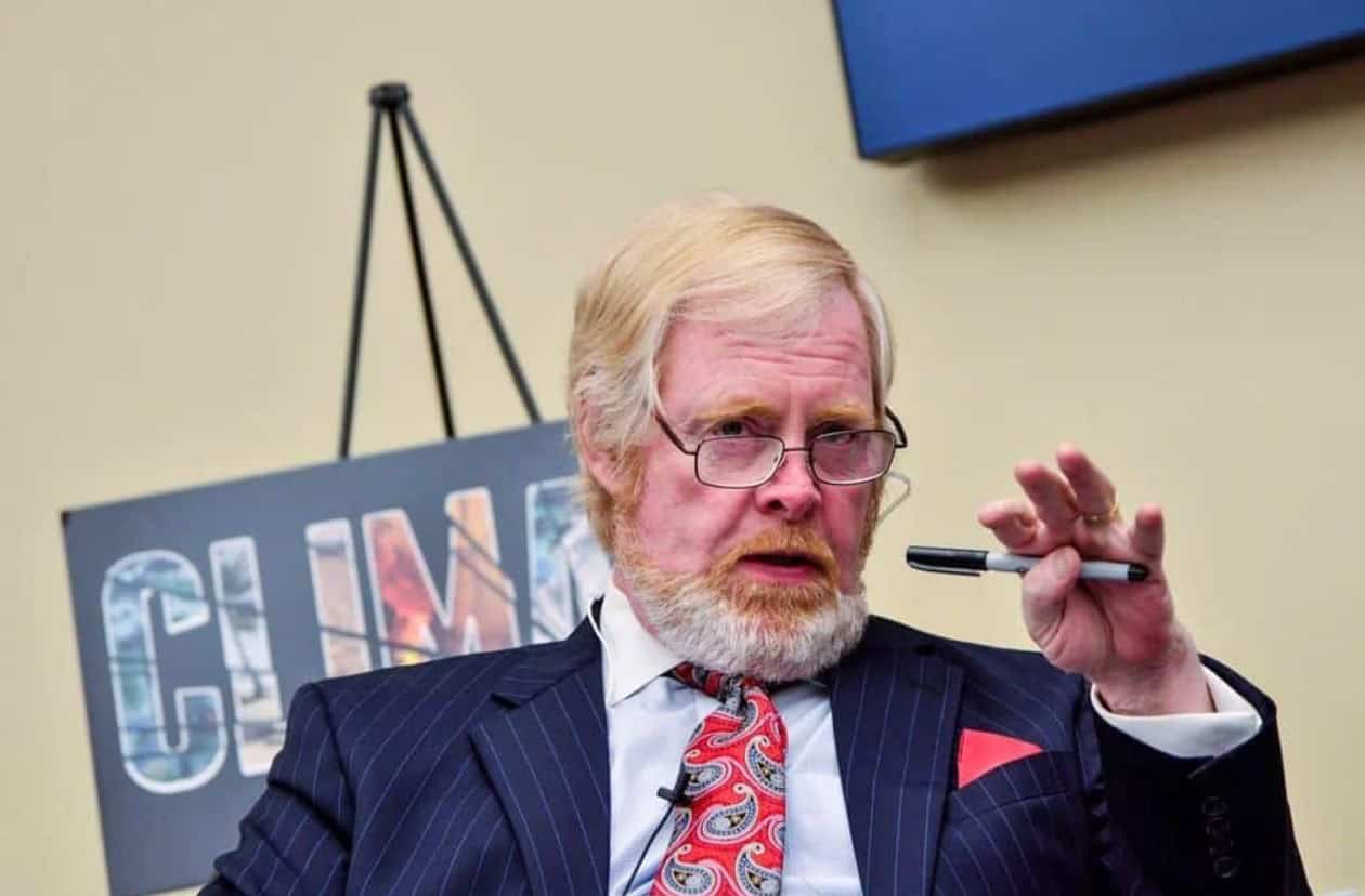 U.S. envoy speaking at a meeting in South Africa, discussing diplomatic relations.