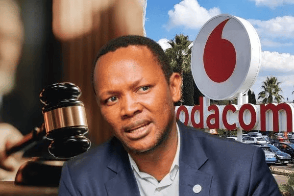 Man speaking outside Vodacom store in Africa, celebrating new year 2026.