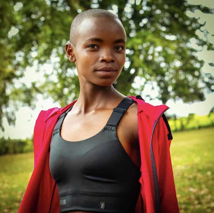 Mercy Chepngeno, Kenyan athlete, in sportswear outdoors, celebrating new sponsorship deal.