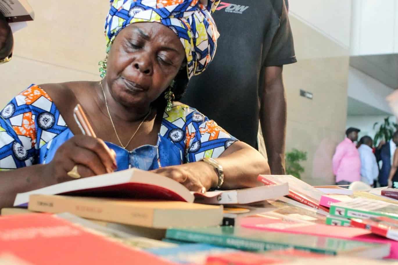 African and Caribbean women at Jamaica Book Festival engaging with African literature.
