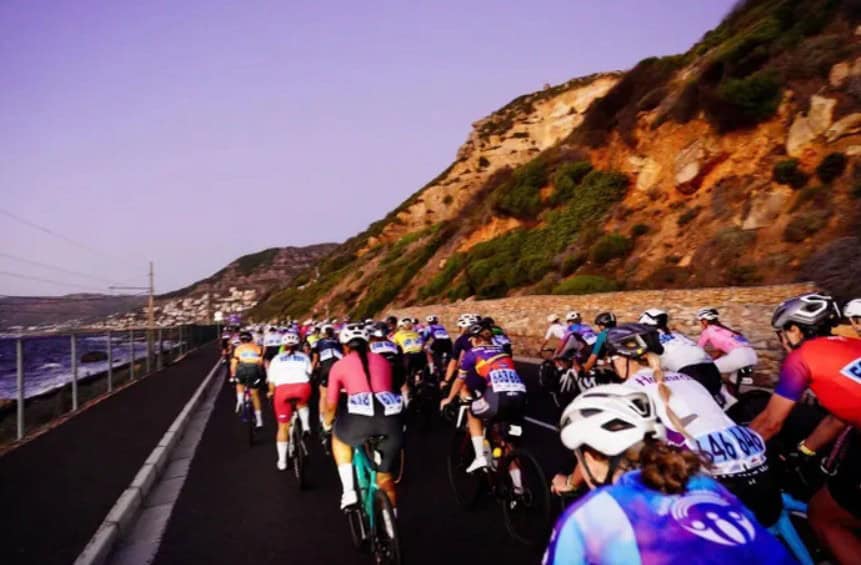 Cyclists competing in the Cape Town Cycle Tour along the stunning South African coastline.