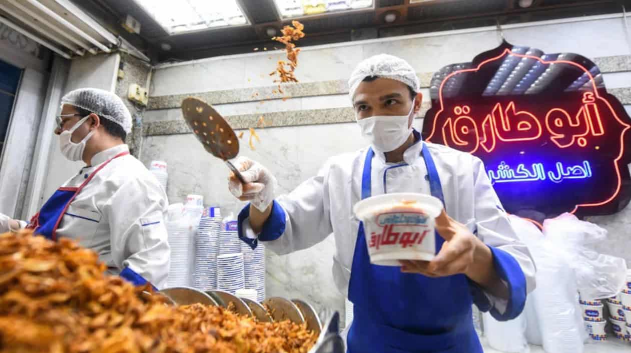 Traditional African street food being served by vendors.