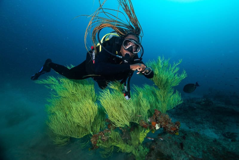 Meet Mama Sli From Sodwana Bay: The Dive Instructor Redefining Access To The Ocean For African Storytellers 1 Diving instructor Mama Sli explores vibrant underwater coral reefs in Sodwana Bay, showcasing Africa.