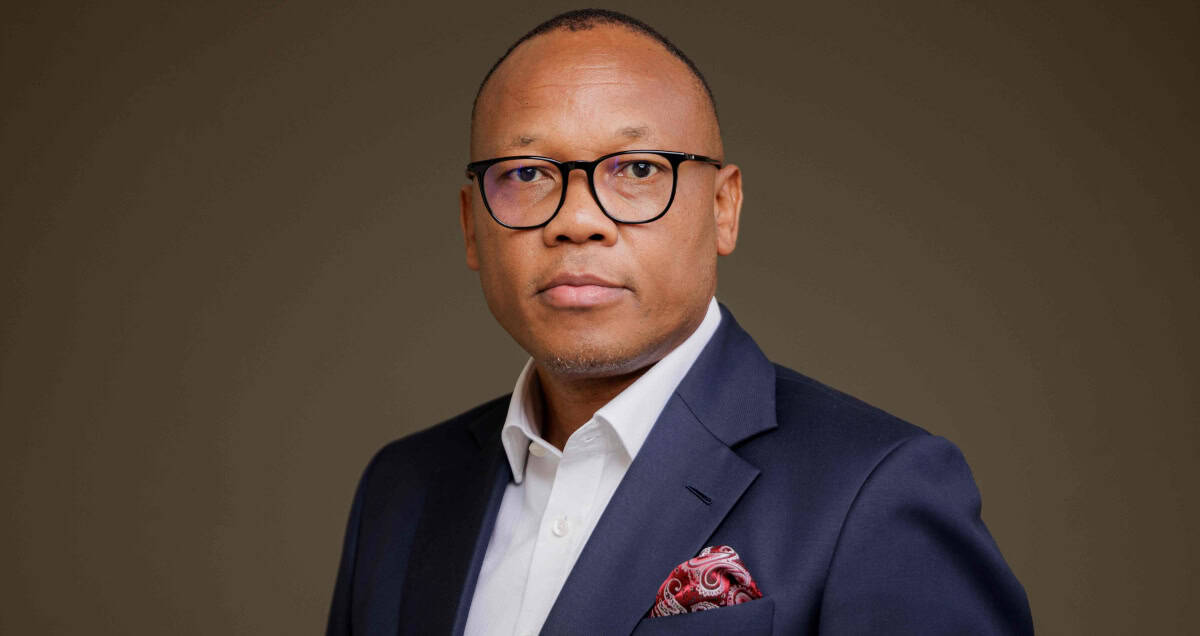 Siseko Ngxola, Ericsson South Africa Country Head, in formal business attire.