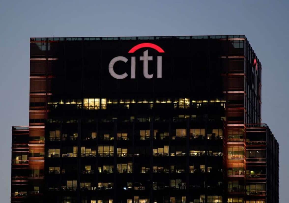 Citi logo illuminated on the top of a modern skyscraper in Africa.