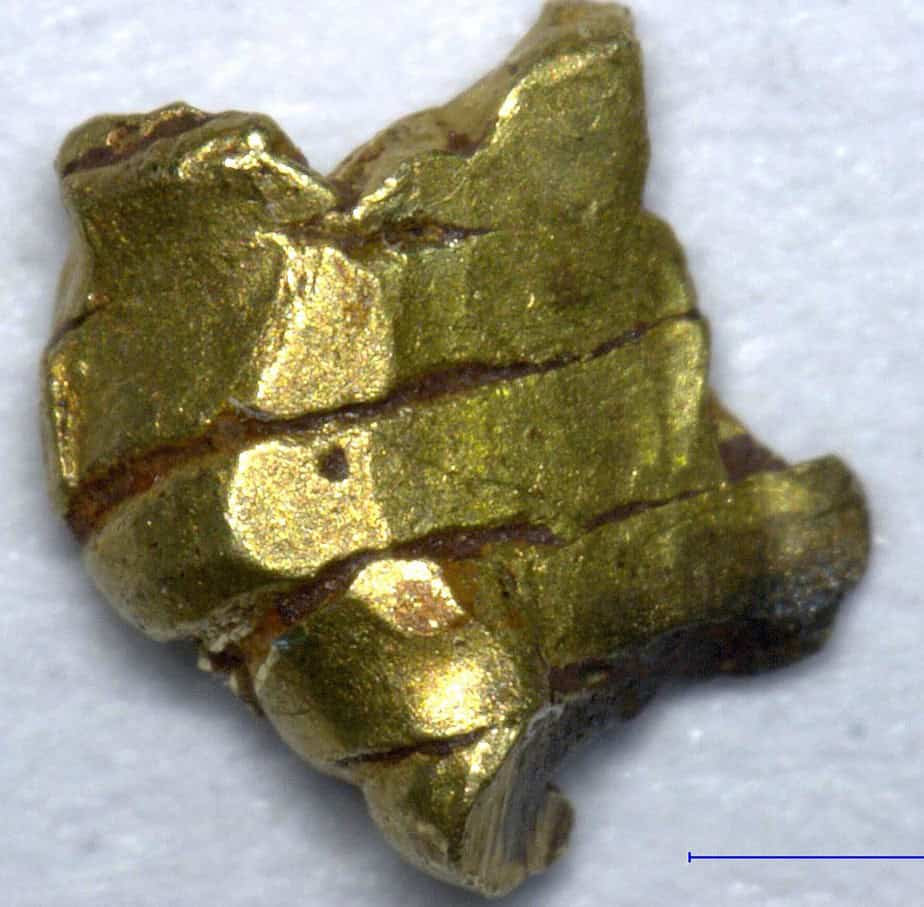 Gold nugget, African mineral specimen with shiny metallic surface.