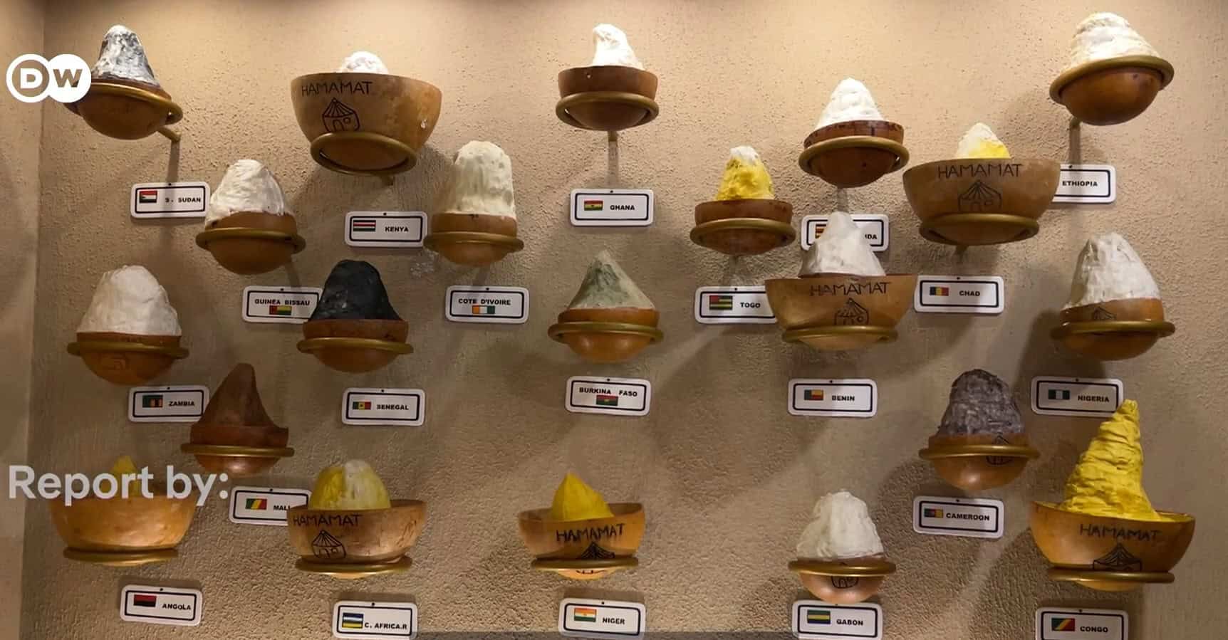 Display of various traditional African salt samples on shelves.