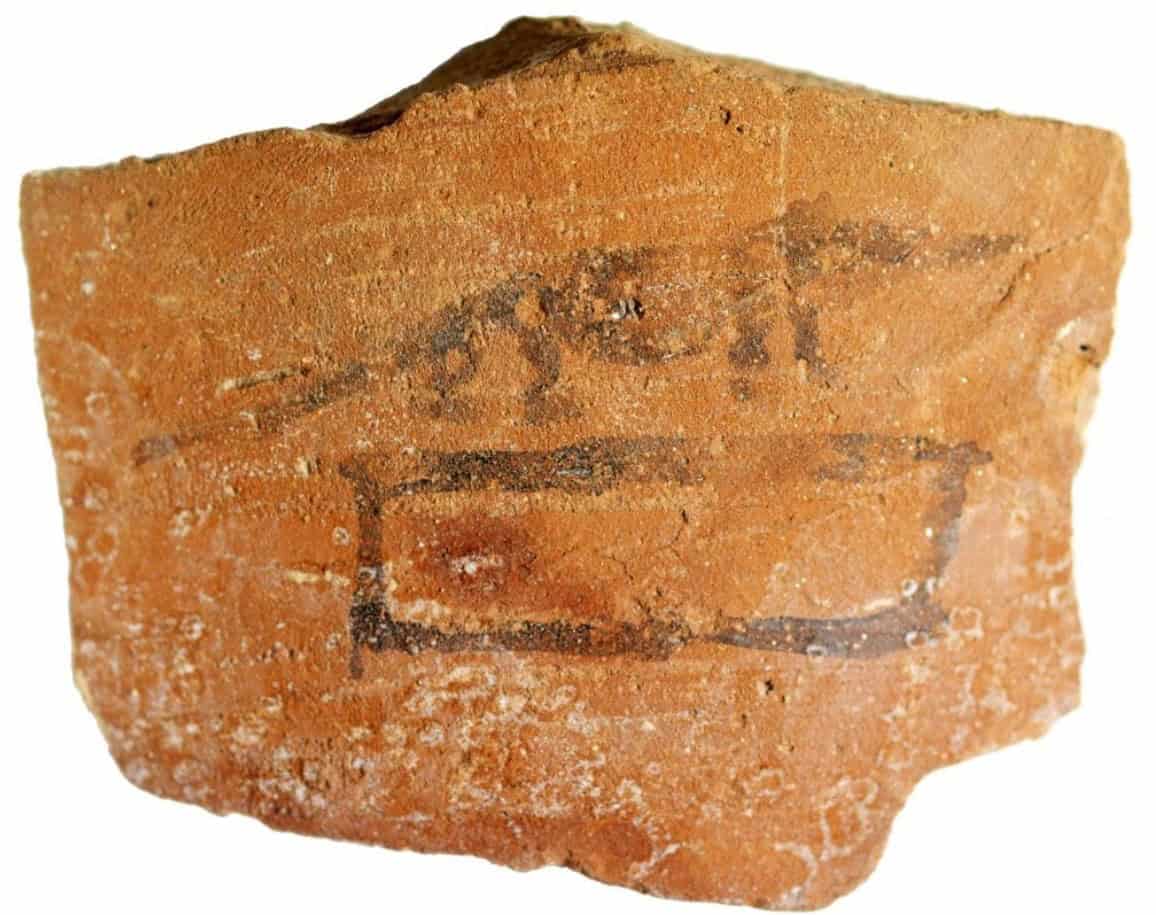 Old African clay pottery fragment with historic markings.