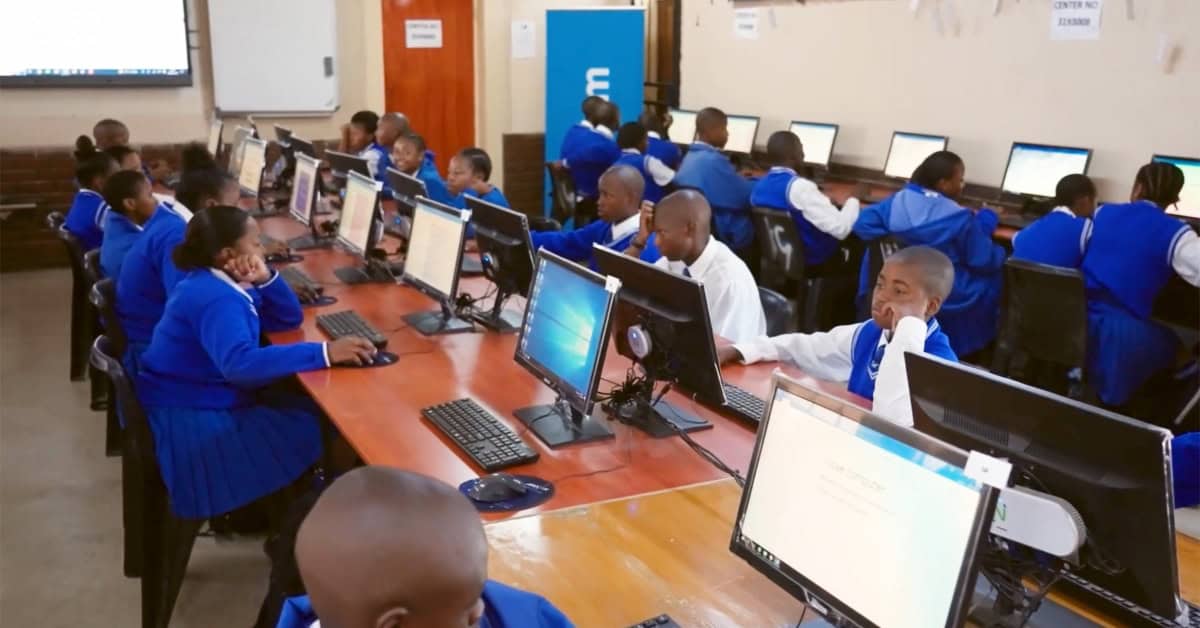Students working on computers in a classroom at Telkom Foundation.