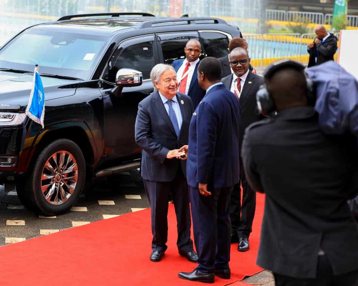 African leaders and officials greeting each other at a formal event in Nairobi, Kenya, with a black.